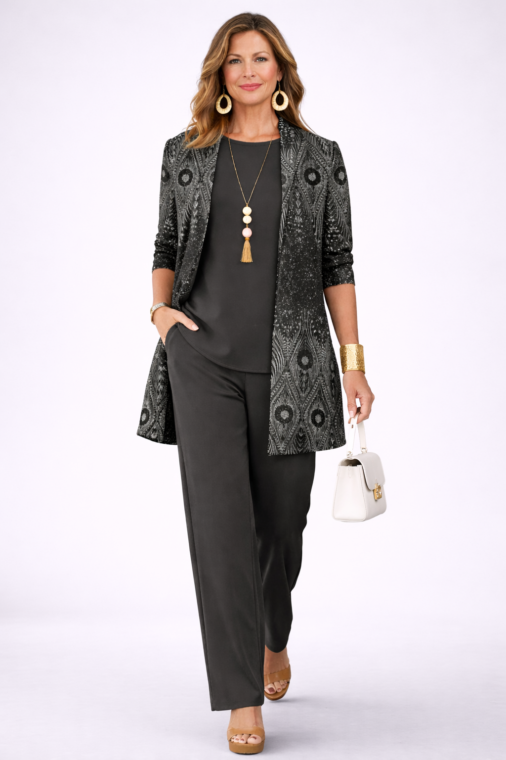 Woman wearing a black three-piece cardigan set with wide-leg trousers