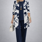 Woman wearing a blue and white three-piece cardigan, top and trousers co-ord set