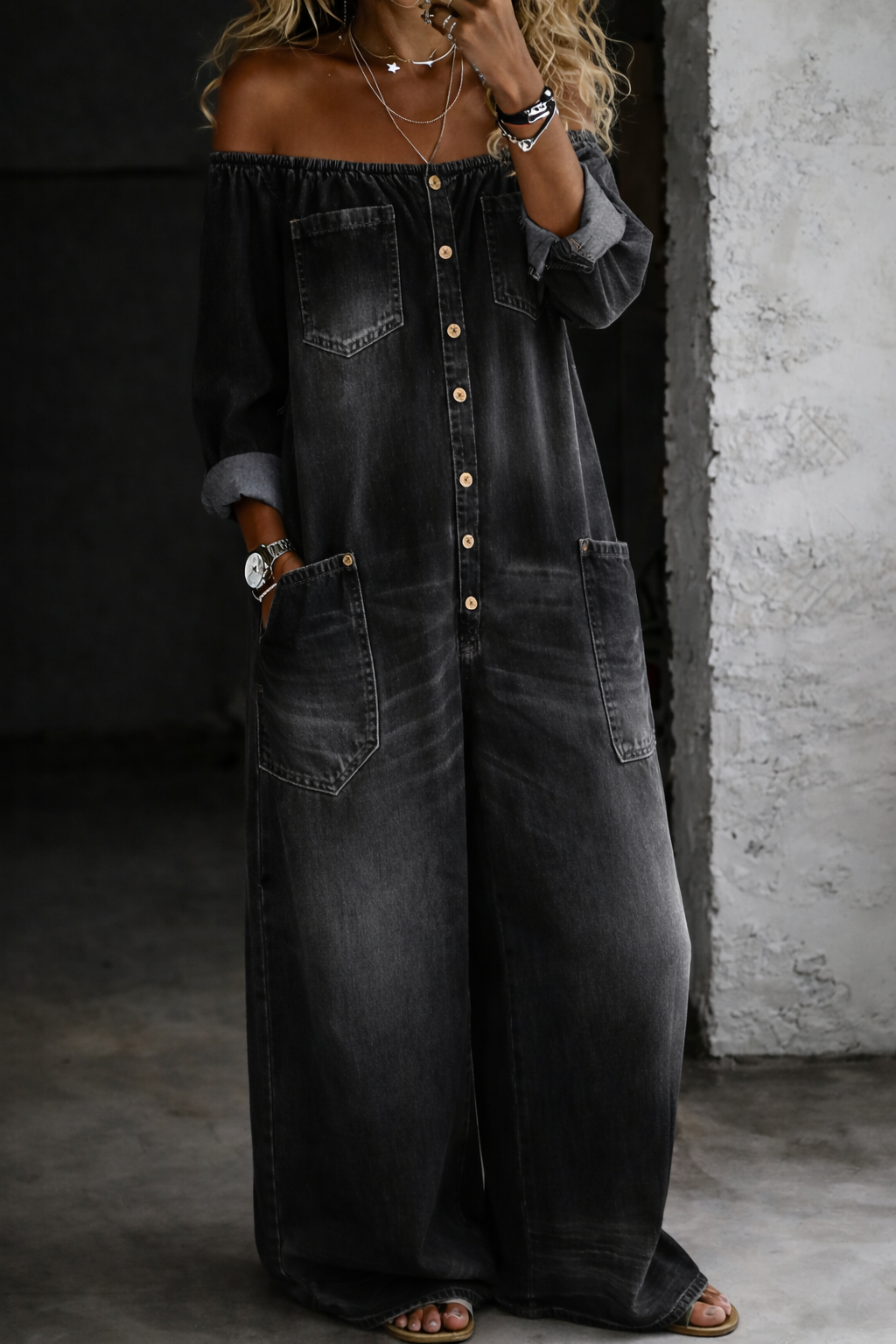 Woman wearing a long-sleeve off-shoulder denim jumpsuit