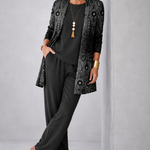 Woman wearing a black three-piece cardigan set with wide-leg trousers