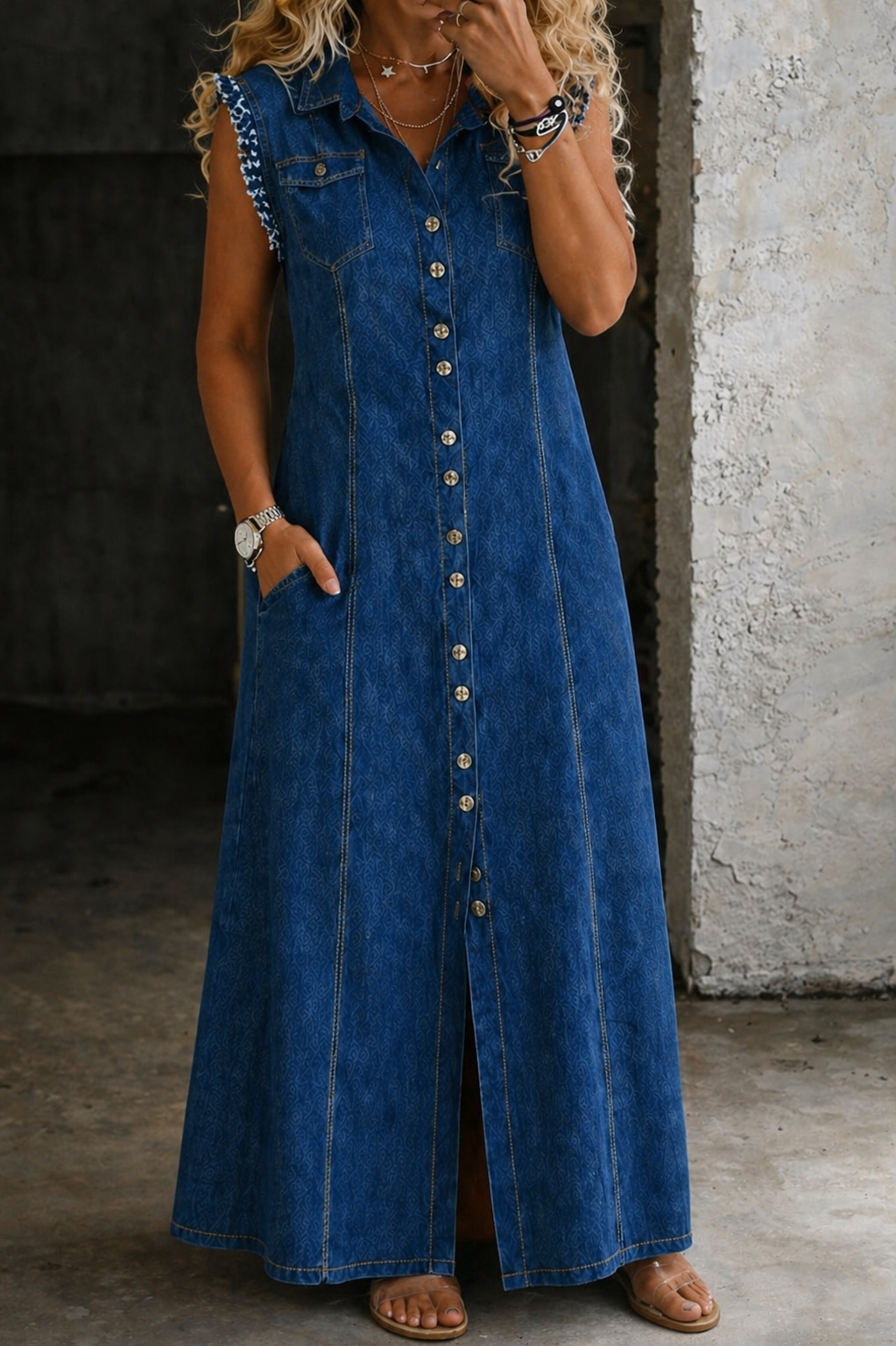 Woman wearing a plus-size sleeveless denim shirt dress
