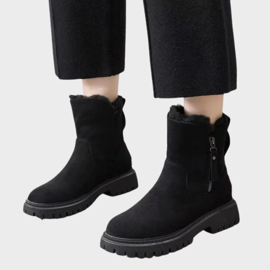 Nora Fur-Trimmed Suede Winter Boots in Black, side view on model
