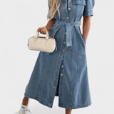 Woman wearing a midi button-front shirt dress with a tie belt