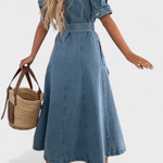 Woman wearing a midi button-front shirt dress with a tie belt