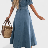 Woman wearing a midi button-front shirt dress with a tie belt