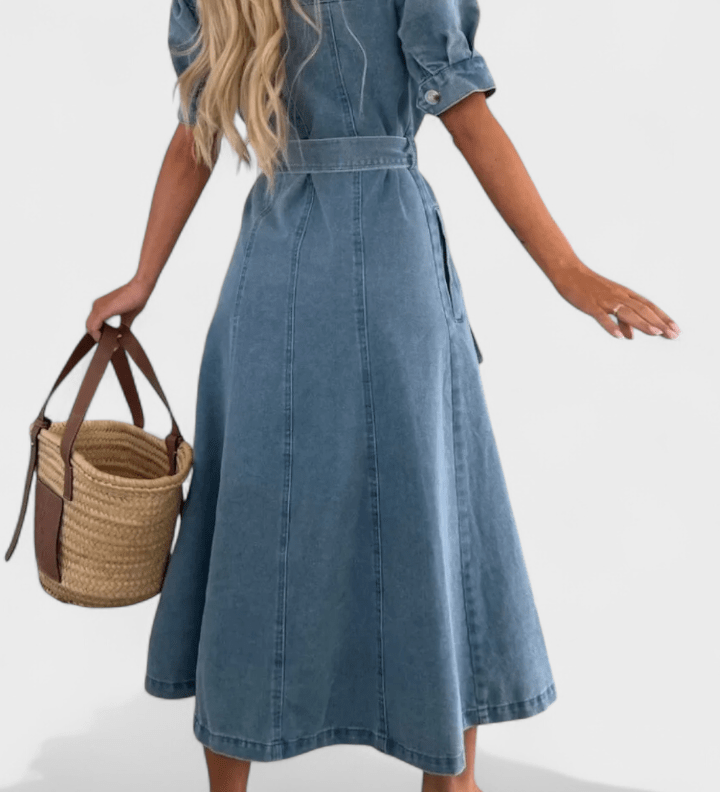 Woman wearing a midi button-front shirt dress with a tie belt