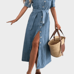 Woman wearing a midi button-front shirt dress with a tie belt