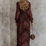 Woman wearing a paisley print zip-waist maxi dress