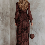 Woman wearing a paisley print zip-waist maxi dress