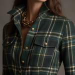 Woman wearing a belted plaid shirt dress with structured collar and flared skirt