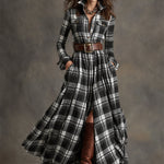 Woman wearing a belted plaid shirt dress with structured collar and flared skirt