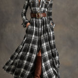 Woman wearing a belted plaid shirt dress with structured collar and flared skirt