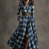 Woman wearing a belted plaid shirt dress with structured collar and flared skirt