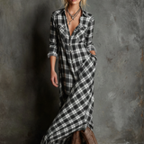Woman wearing a full-length green plaid shirt dress with long sleeves