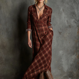 Woman wearing a full-length green plaid shirt dress with long sleeves