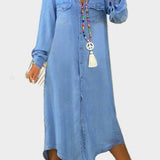 Woman wearing a long button-through denim dress