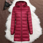 Woman wearing a dark red long padded jacket