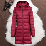 Woman wearing a dark red long padded jacket