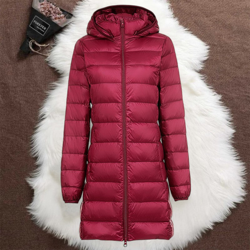 Woman wearing a dark red long padded jacket