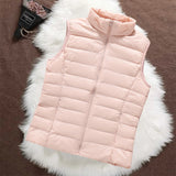 Woman wearing a light pink padded gilet