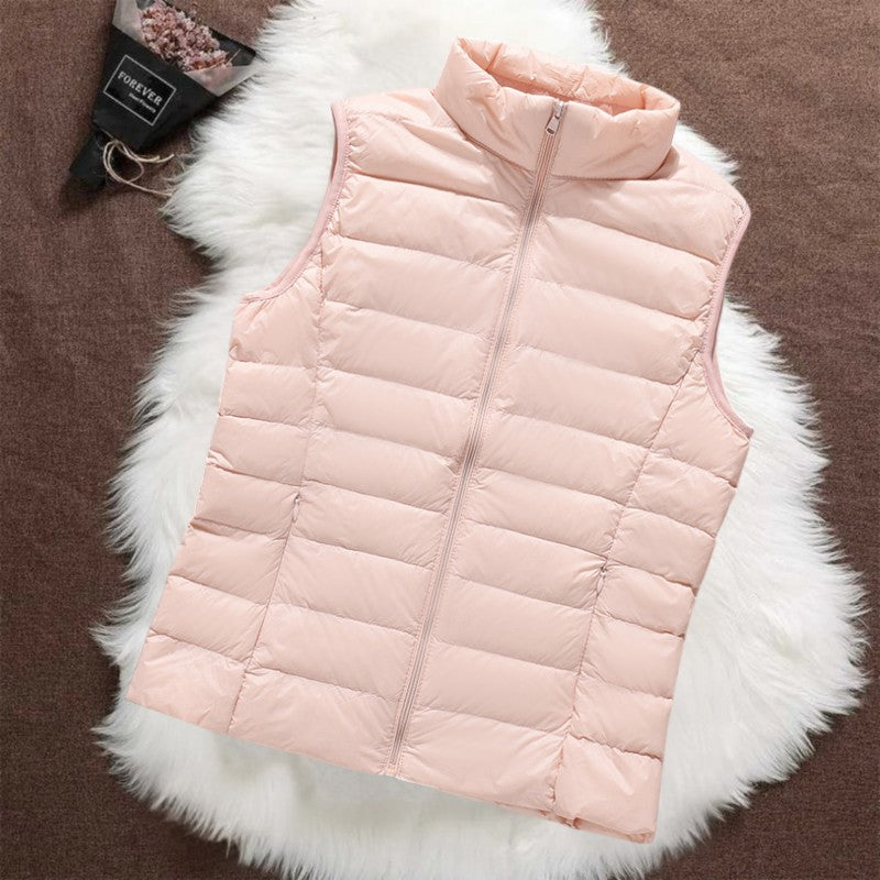 Woman wearing a light pink padded gilet