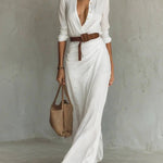 Woman wearing a wrap-style maxi dress with belt