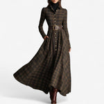 Woman wearing a belted vintage plaid maxi dress