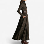 Woman wearing a belted vintage plaid maxi dress
