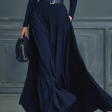 Woman wearing a high-neck A-line maxi dress