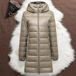 Woman wearing a champagne long padded jacket