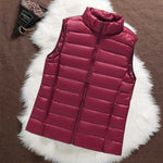 Woman wearing a dark red padded gilet
