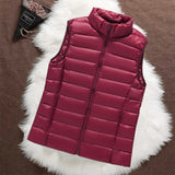 Woman wearing a dark red padded gilet