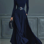 Woman wearing a high-neck A-line maxi dress