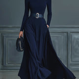 Woman wearing a high-neck A-line maxi dress
