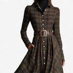 Woman wearing a belted vintage plaid maxi dress