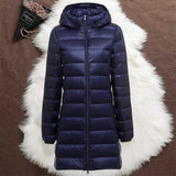 Navy blue long padded jacket with a removable hood