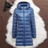 Woman wearing an indigo long padded jacket