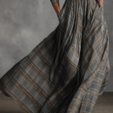 Woman wearing a vintage plaid shirt dress with full skirt