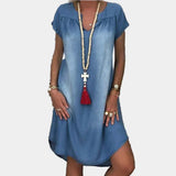 Woman wearing a loose short-sleeve denim dress