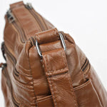 Multi-Zip Shoulder Bag by Eleanor Vale