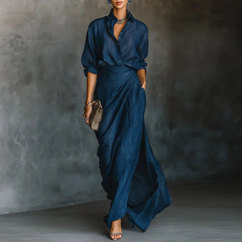 Woman wearing a pleated two-piece maxi skirt set