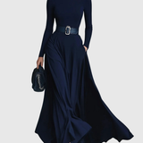 Woman wearing a high-neck A-line maxi dress