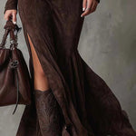 Woman wearing a suede-look zip-front maxi dress