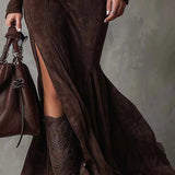 Woman wearing a suede-look zip-front maxi dress