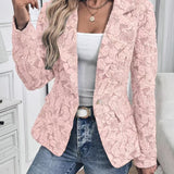 Woman wearing a paisley jacquard blazer
