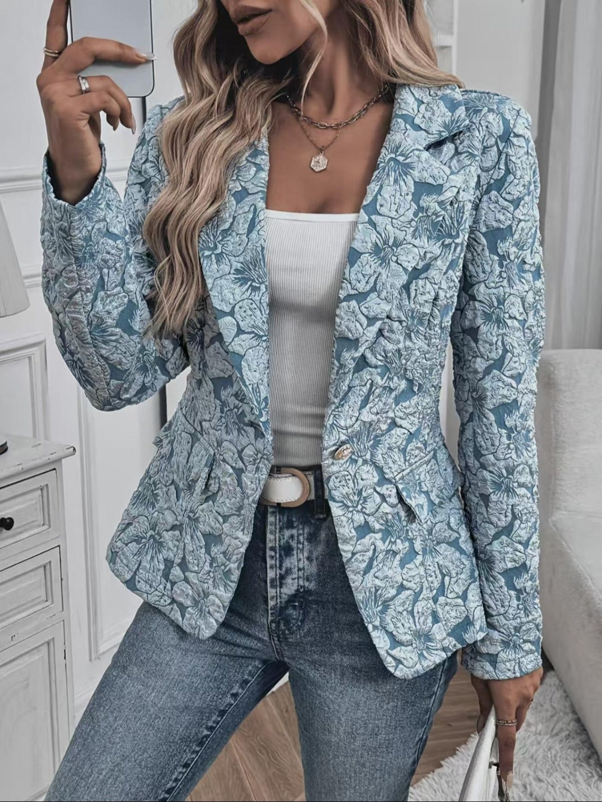 Woman wearing a paisley jacquard blazer
