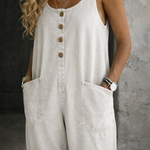 Woman wearing a sleeveless vintage-style cotton jumpsuit with square neckline
