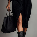 Woman wearing a corduroy button-down shirt dress