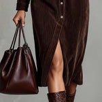Woman wearing a corduroy button-down shirt dress