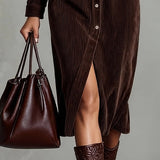 Woman wearing a corduroy button-down shirt dress